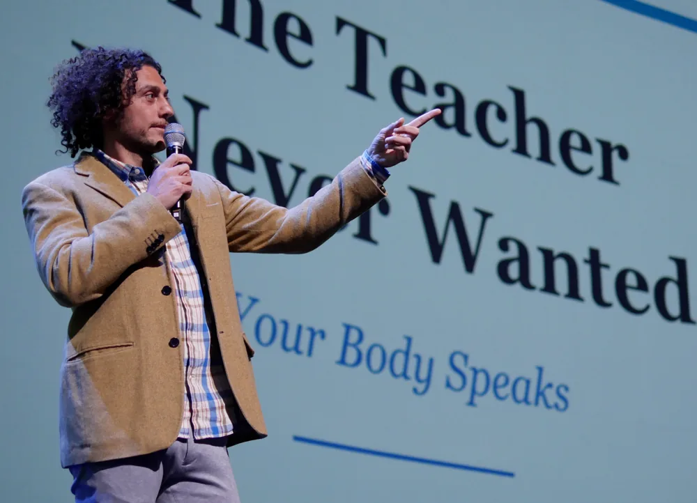 Nima Koucheki speaking about nutrition and supplement science on stage